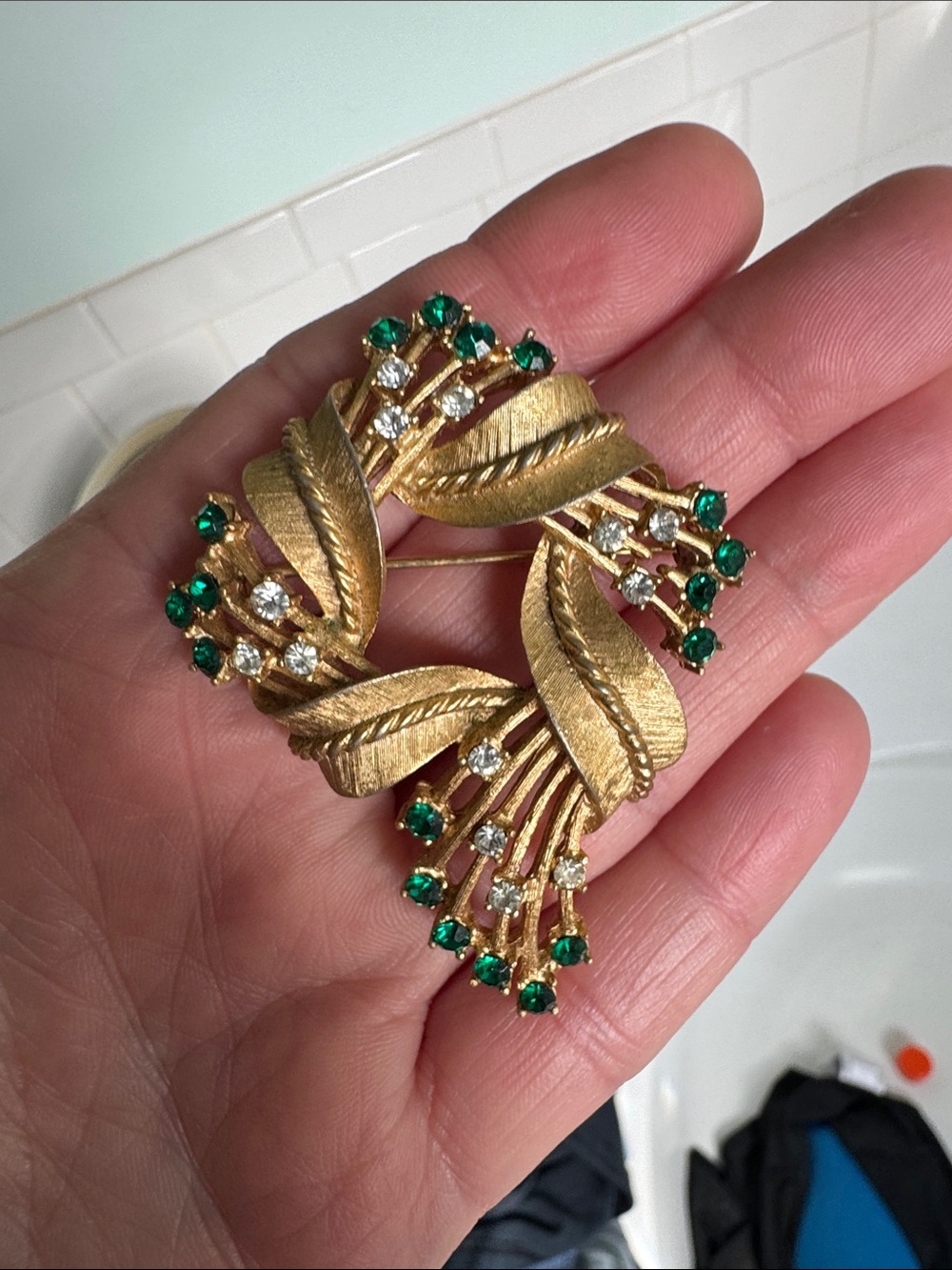 Trifari Gold-Tone Wreath Brooch with Emerald Green and Clear rhinestones.